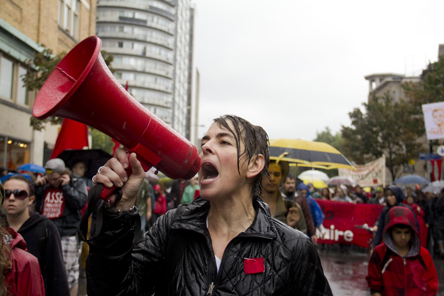 Despite the persistent rainfall, protesters marched downtown on Saturday Sept. 22 in a demonstration organized by Coalition Large de l’Association pour un Solidarité Syndicale Étudiante (CLASSE). (Luke Orlando / McGill Tribune)